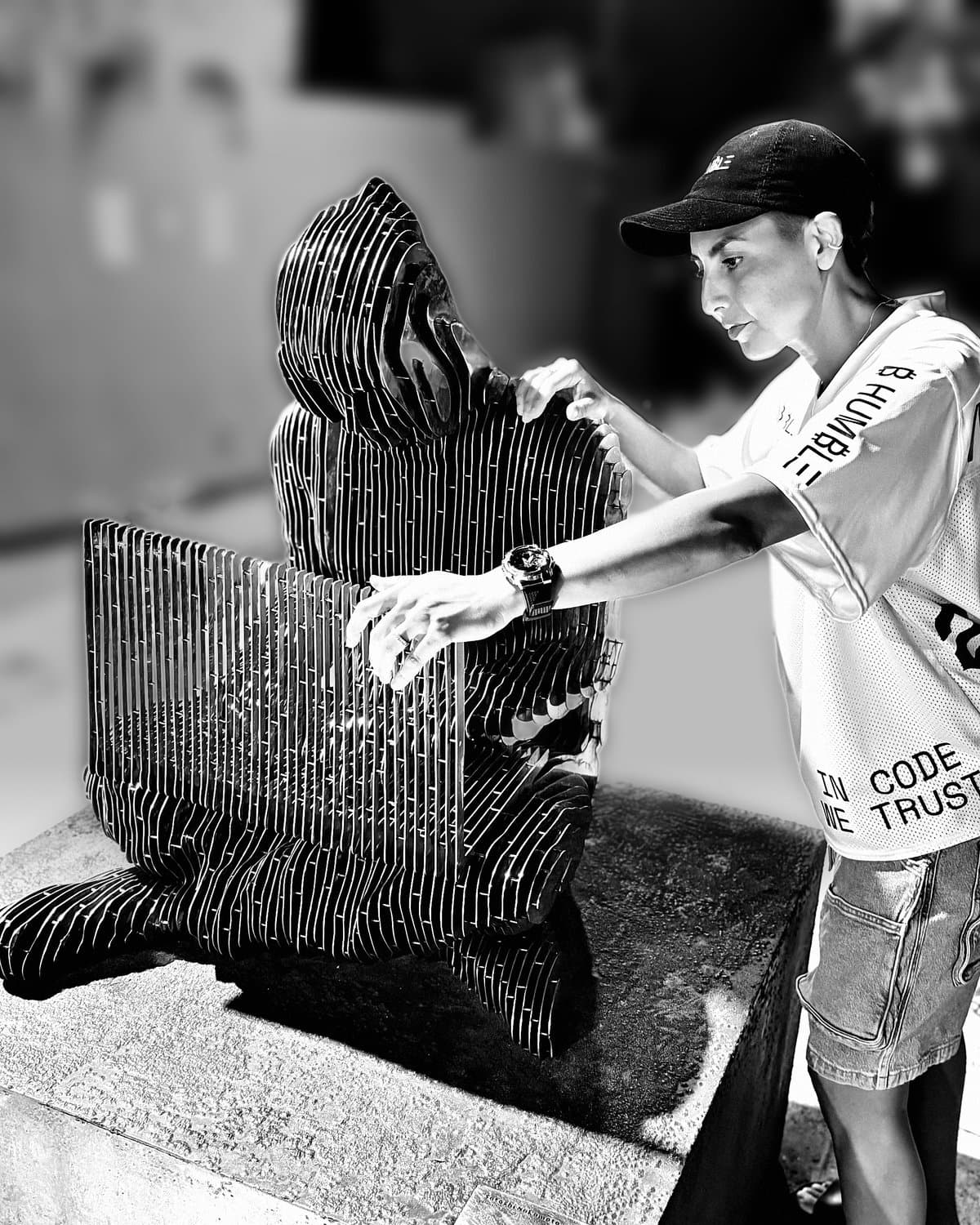 Christine with Valentina Picozzi's disappearing Satoshi Nakamoto statue at Bitcoin Beach, El Zonte, El Salvador